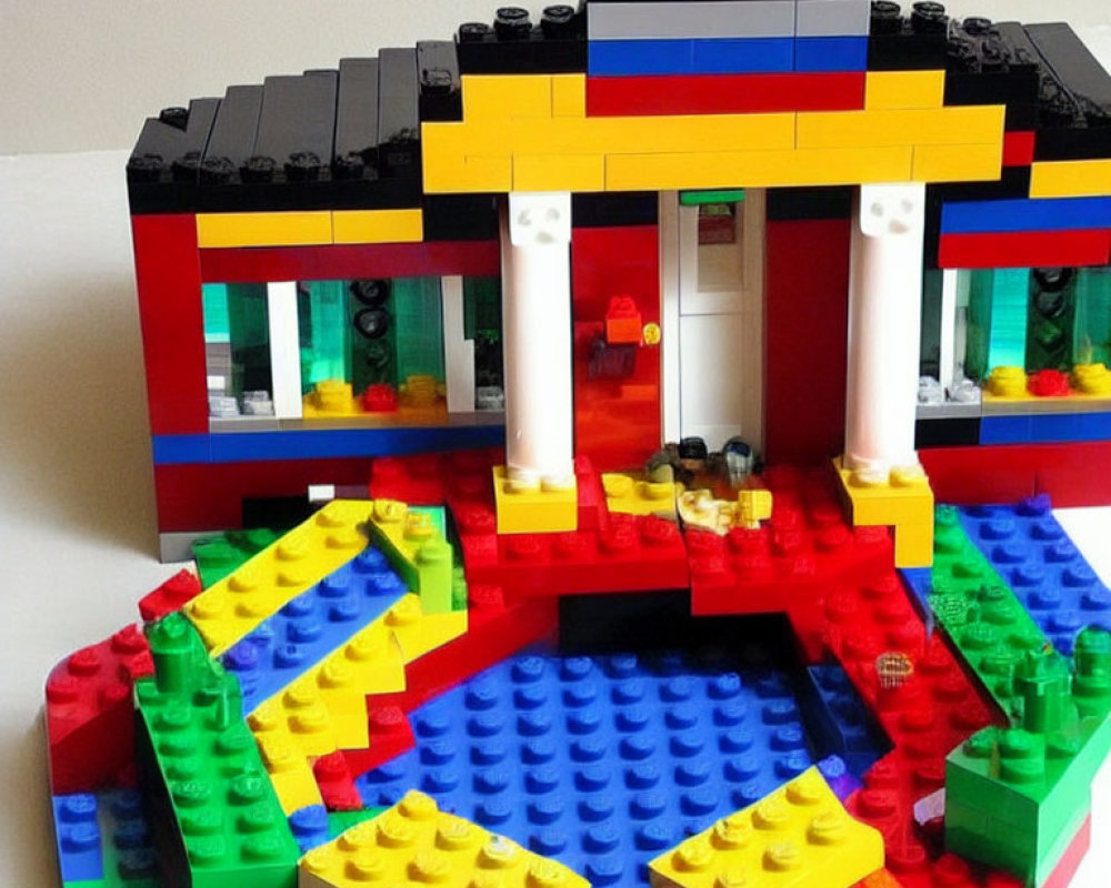 Vibrant Lego building with red, blue, and black exterior & colorful interior