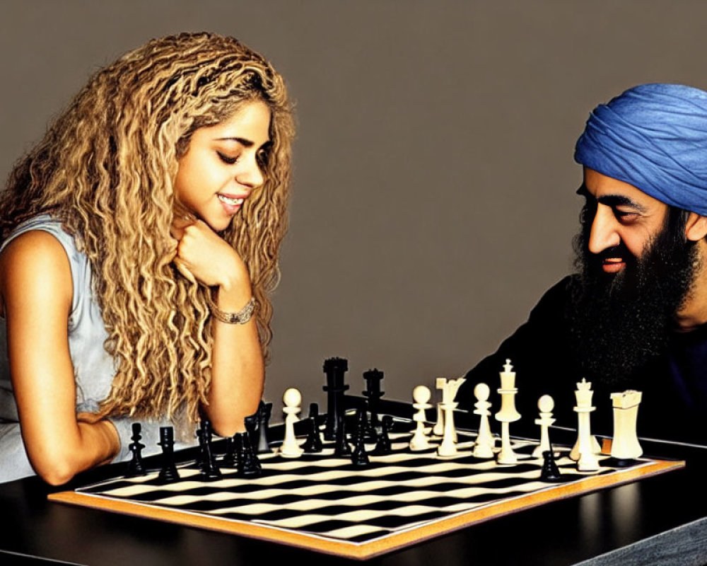 Man and woman playing chess with blue turban and smile.