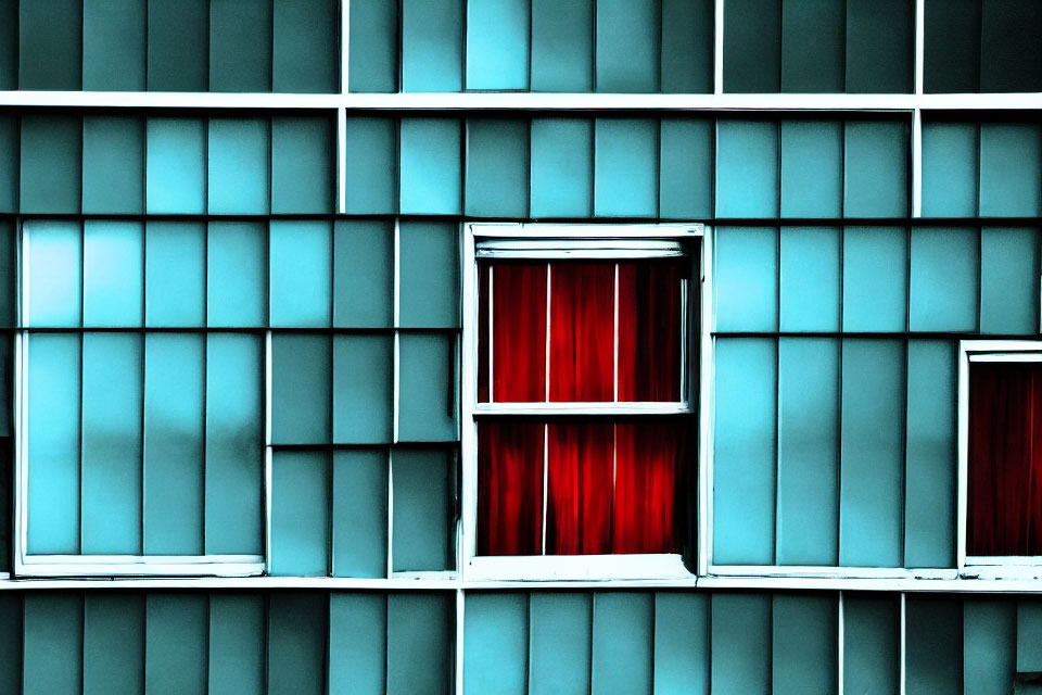 Geometric blue building facade with red curtain window contrast