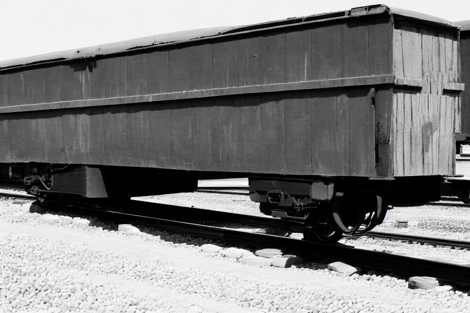 Monochrome image of vintage railway freight car in sunlight