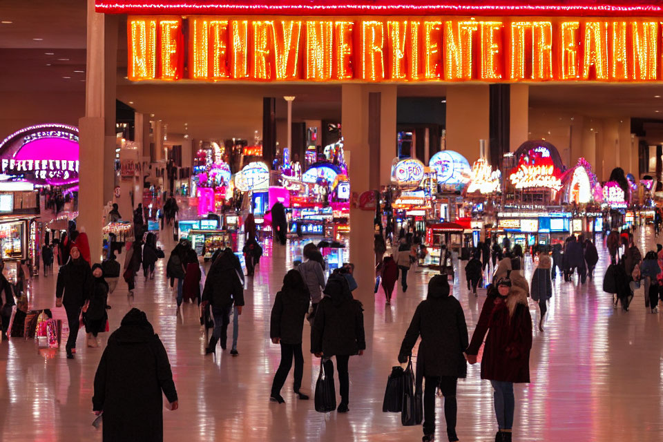 Busy airport terminal with neon signs and passengers carrying luggage.