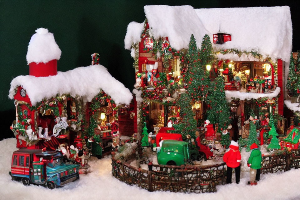 Snow-covered Christmas village with decorated houses, trees, figurines, and vintage vehicles.