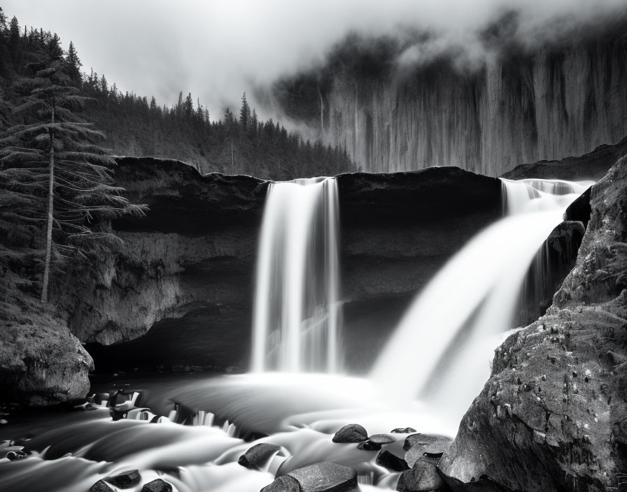 Monochrome landscape: Majestic waterfall, rocky terrain, forest ambiance