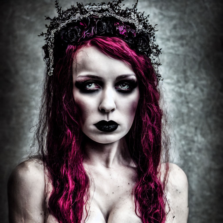 Red-Haired Person in Dark Makeup with Black Crown and Somber Expression