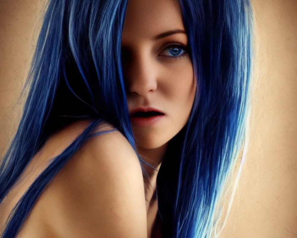 Portrait of person with striking blue hair and captivating eyes.