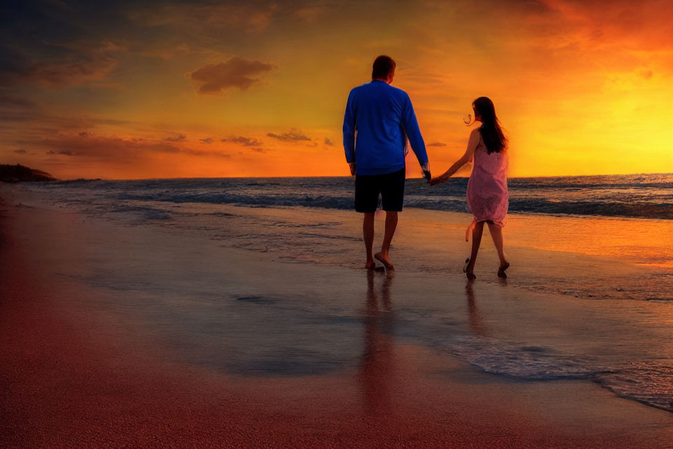 Sunset beach scene with two people holding hands