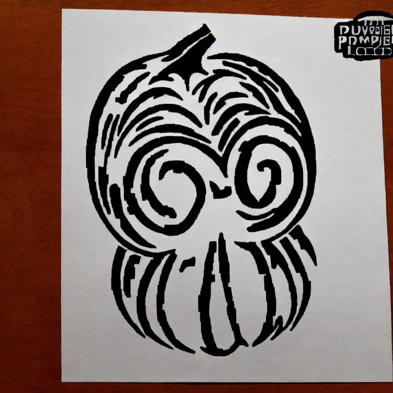 Monochrome pumpkin drawing with swirl eyes on paper