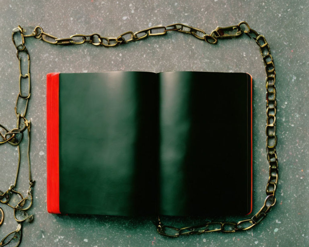 Blank Pages Black Book with Rusty Chain on Grey Surface