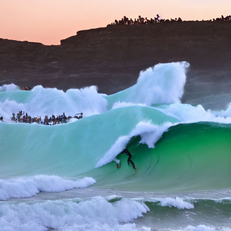 Surfer Riding Large Wave at Sunset with Onlookers on Rocky Cliff