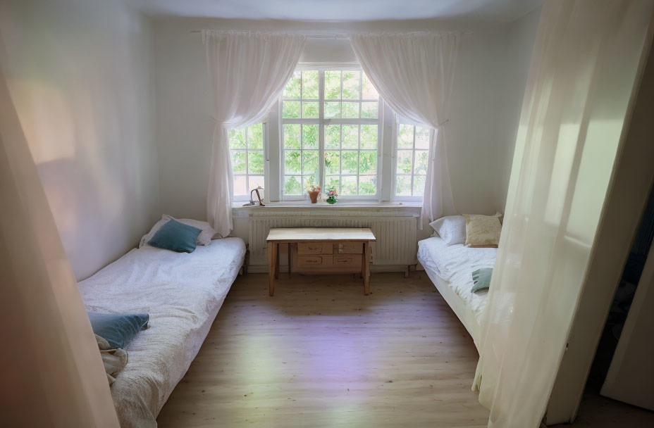 Two single beds bedroom with wooden desk and window view.