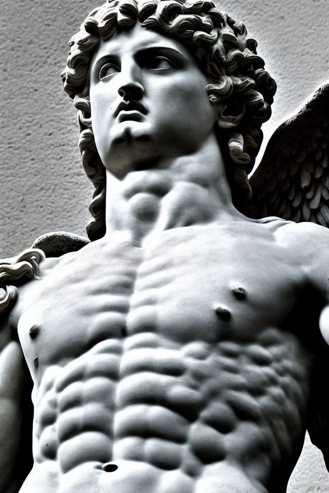 Marble statue close-up: Angel with muscular torso and curly hair