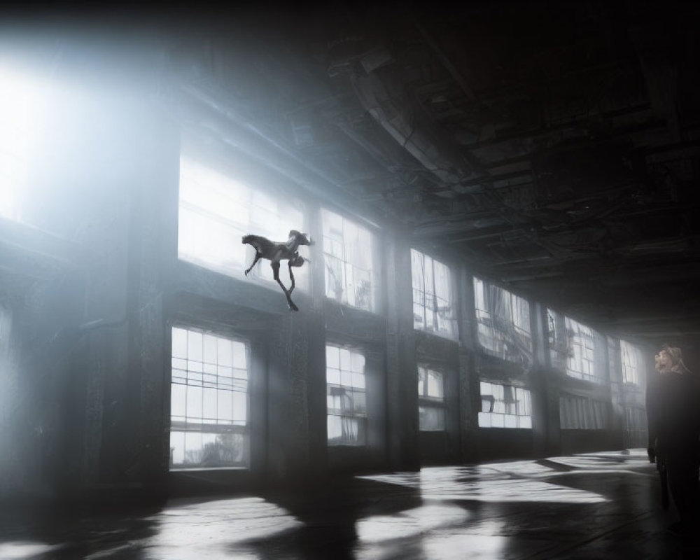 Dancer mid-leap in misty industrial hall with observer.