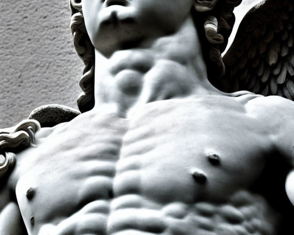 Marble statue close-up: Angel with muscular torso and curly hair