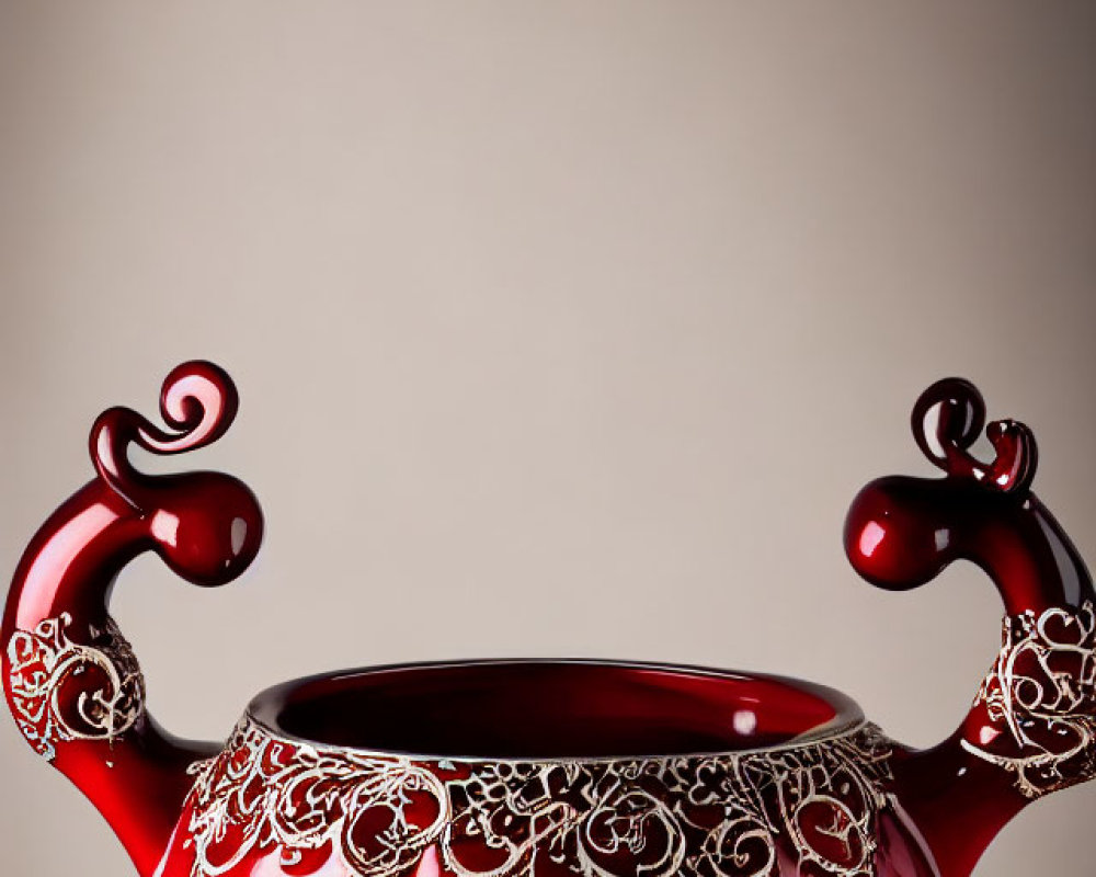 Red Teapot with Silver Patterns and Curled Handles on Gradient Background