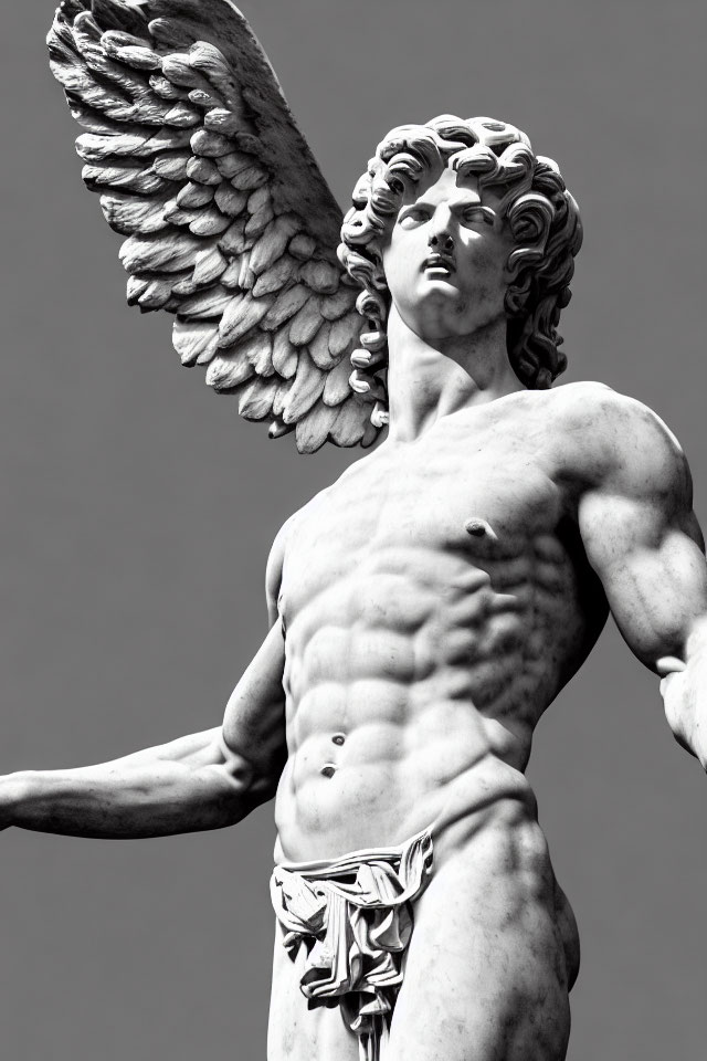 Monochrome photo of classical angel sculpture with intricate wings.