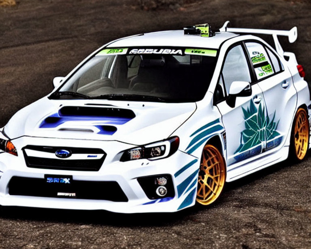 Custom White Subaru WRX with Blue Graphics, Aftermarket Wheels, and Rear Spoiler on Asphalt Road