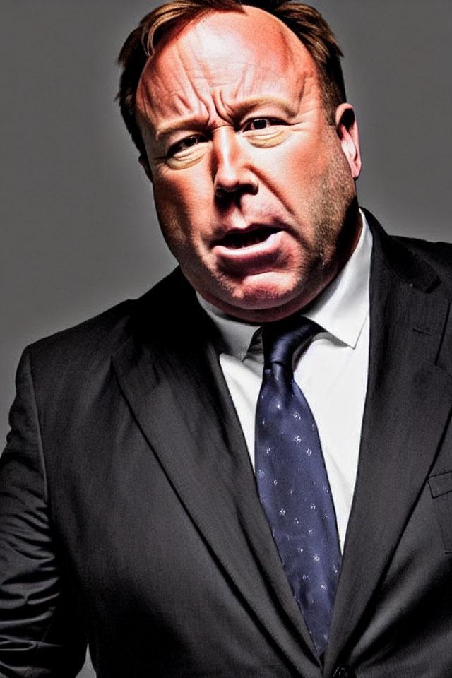 Man in Suit with Open-Mouthed Expression on Grey Background