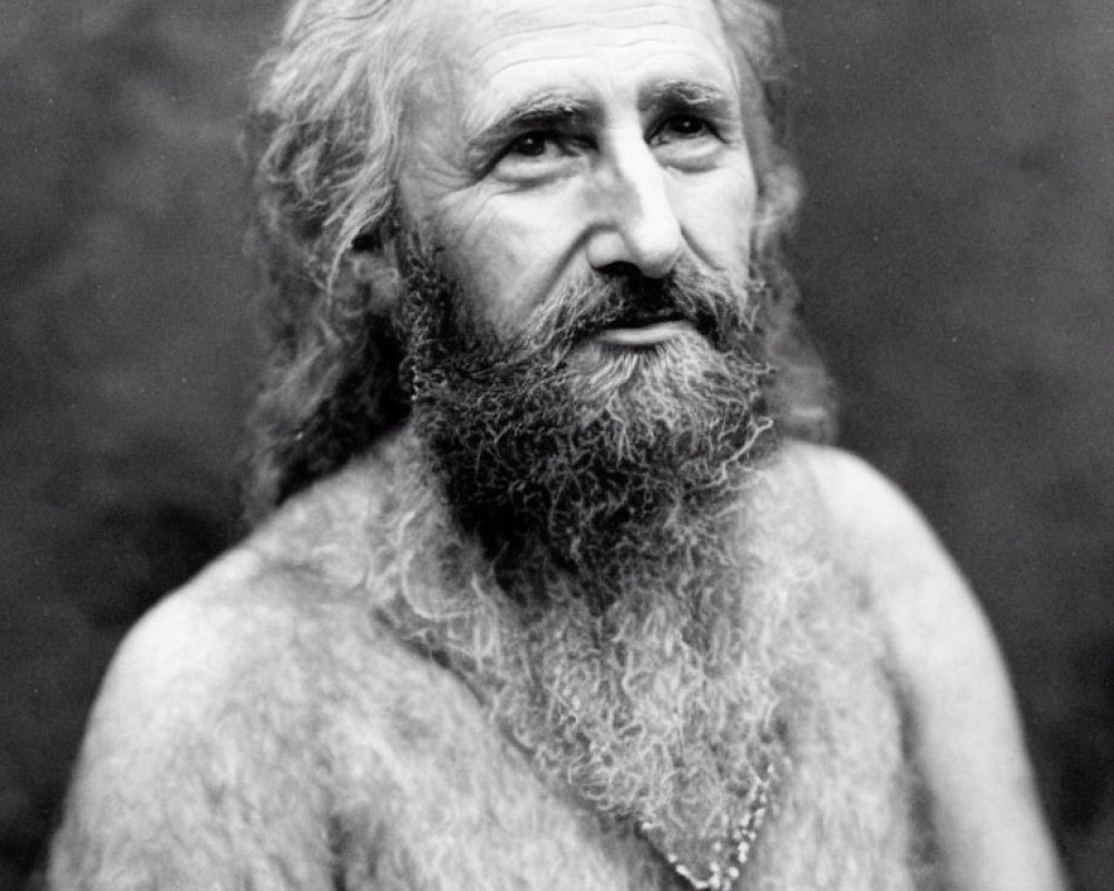 Monochrome portrait of elderly man with long hair and beard