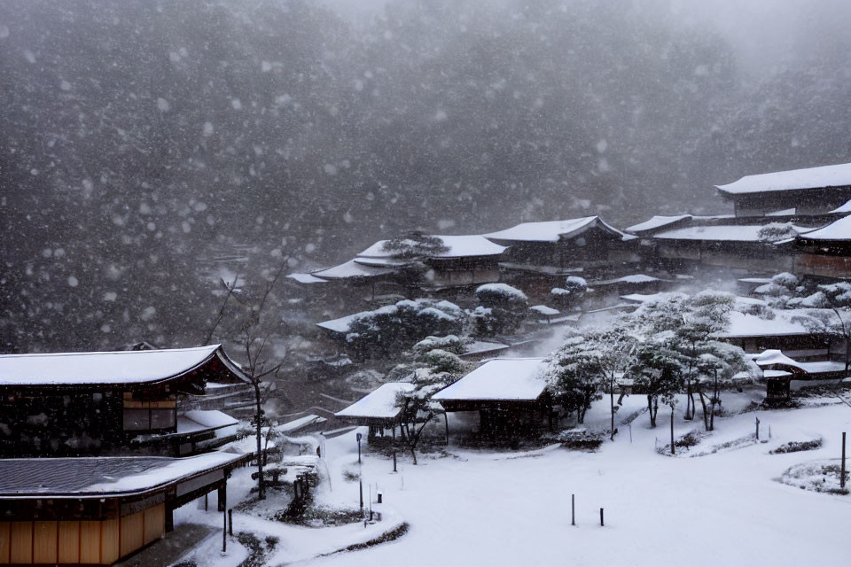 Snow-covered Asian-style buildings and gardens in heavy snowfall