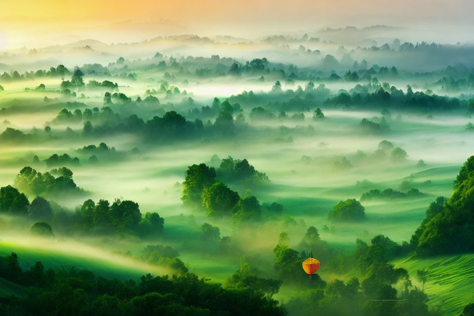 Tranquil landscape with misty hills, trees, and hot air balloon