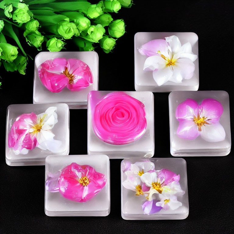 Handmade Floral Soaps with Pink and White Flowers on Black Background