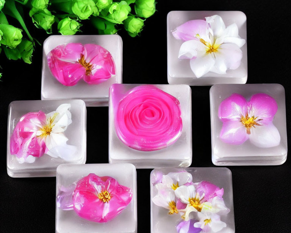 Handmade Floral Soaps with Pink and White Flowers on Black Background