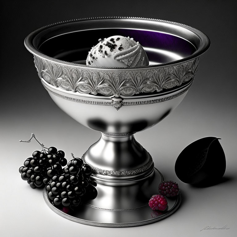 Silver goblet with ice cream, grapes, raspberry, and plum on gray surface