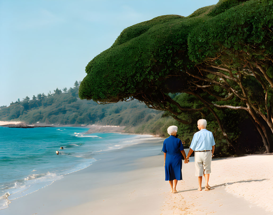 Elderly couple walking on sandy beach near lush tree