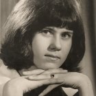 Classic Black-and-White Portrait of Woman with Curly Hair and Striking Makeup