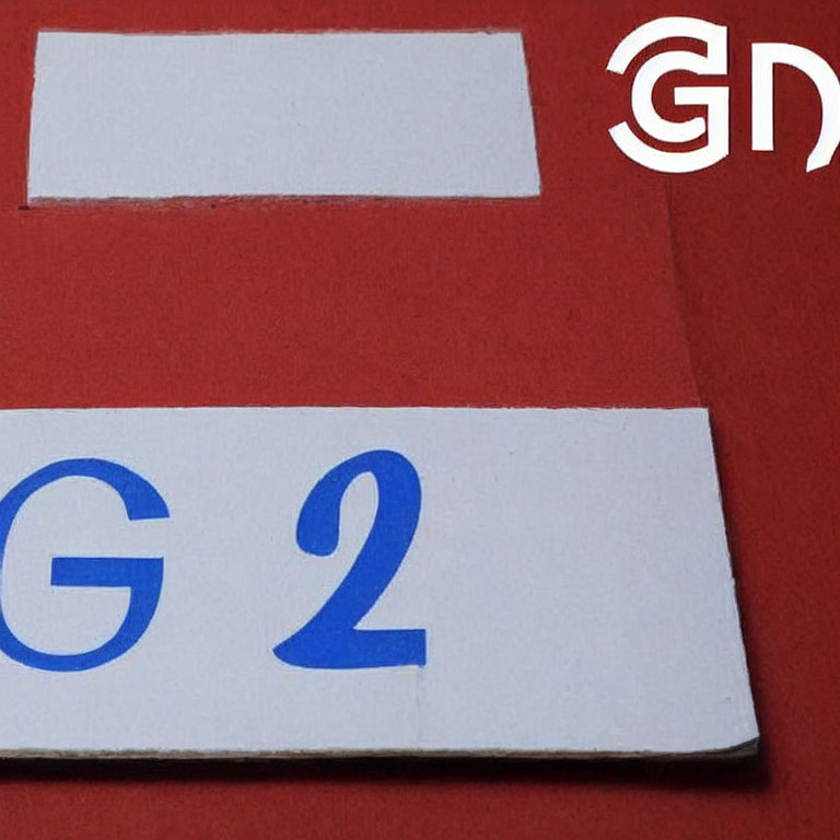 Red background document with white spaces and blue text "G 2" - symbol in corner