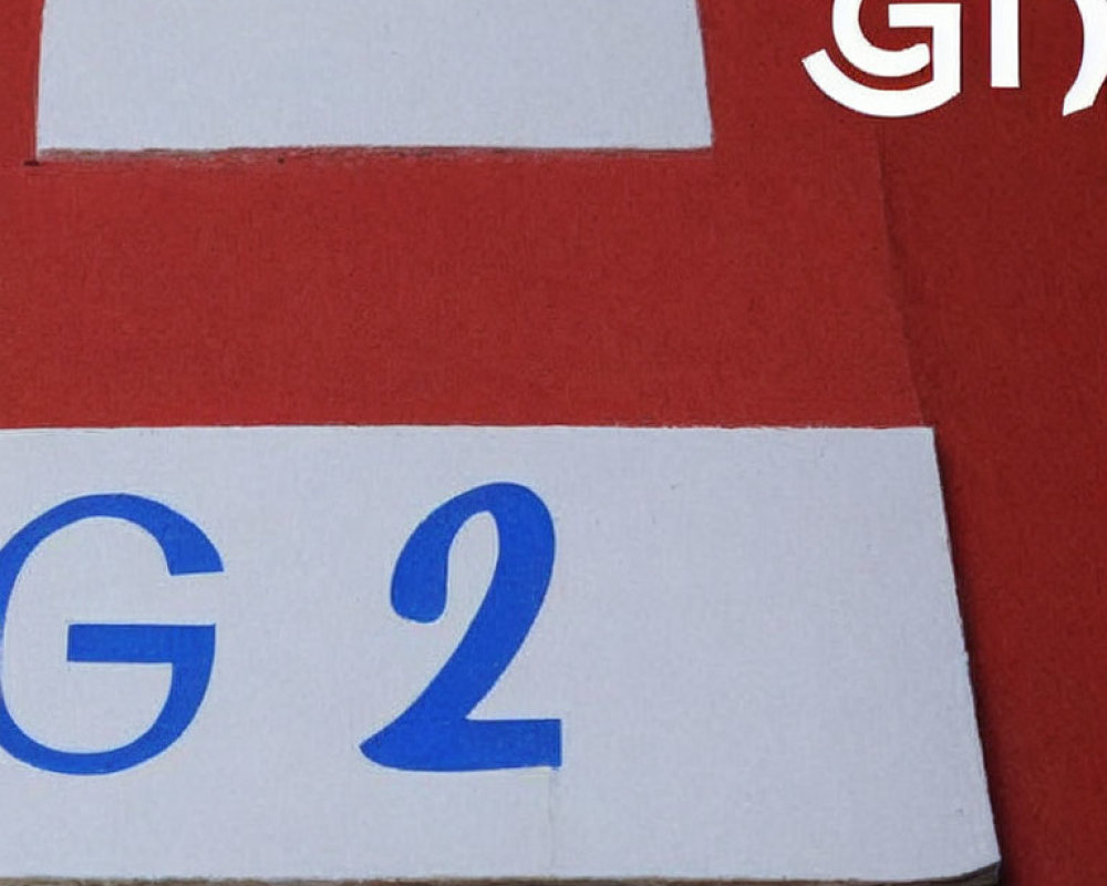 Red background document with white spaces and blue text "G 2" - symbol in corner