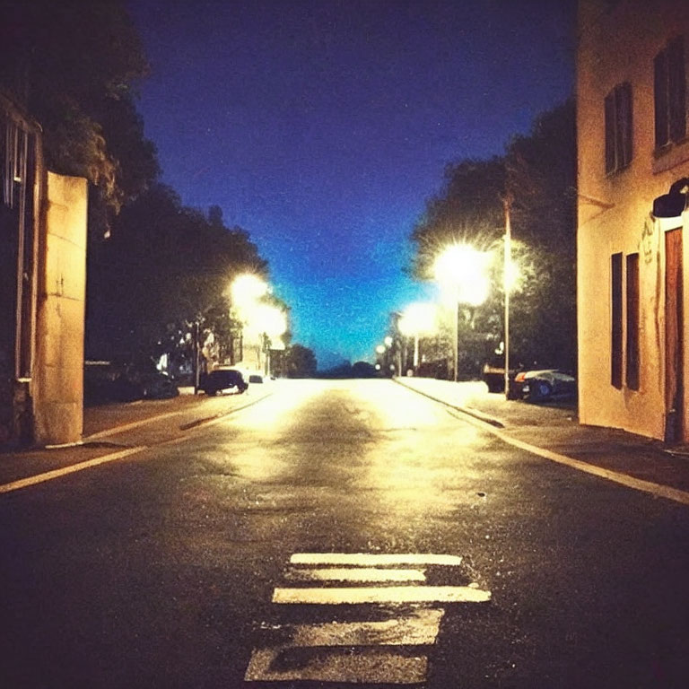 Dimly Lit Night Street with Yellow Streetlights and Twilight Sky Gradient