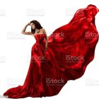 Luxurious Red Gown with Rose Patterns and Cascading Ruffle Design