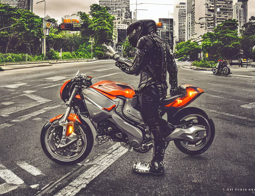 Motorcyclist in black gear with smartphone next to orange sport bike at city intersection