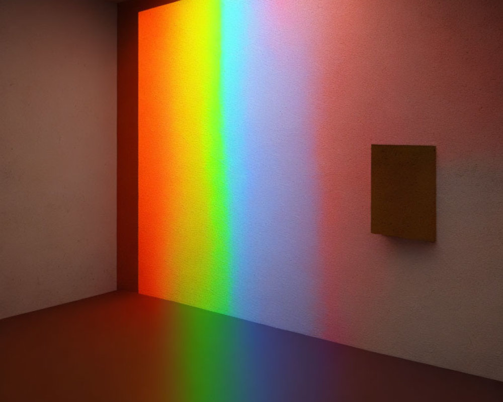 Colorful rainbow projection in room with cork bulletin board