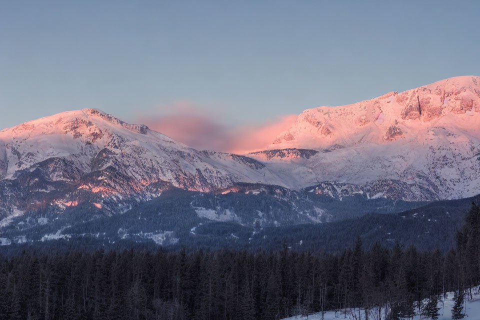 Sunset Colors Illuminate Snow-Covered Mountains