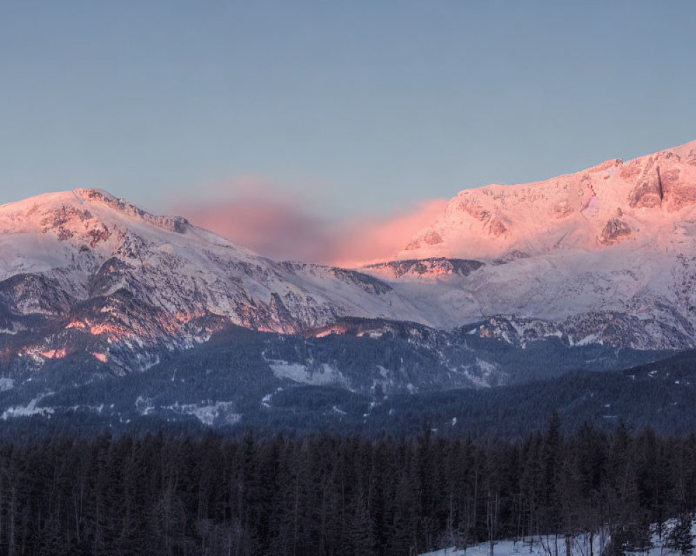 Sunset Colors Illuminate Snow-Covered Mountains