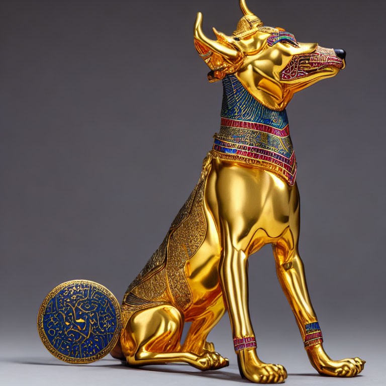 Golden Seated Anubis Statue with Egyptian Patterns and Circular Symbol