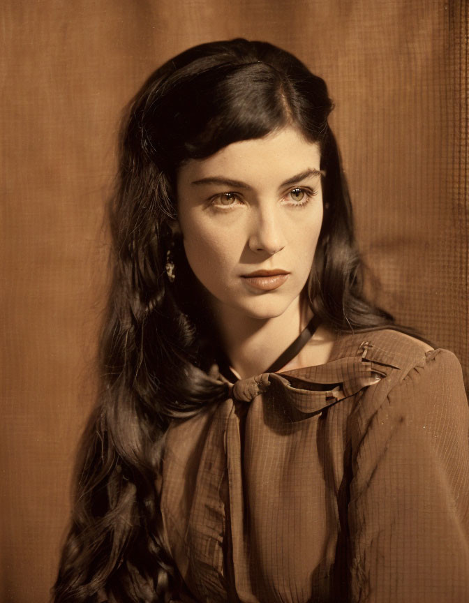 Vintage Portrait of Woman with Dark Wavy Hair and Bow-Tied Blouse