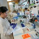 Female Scientist Conducting Experiment in Lab Setting