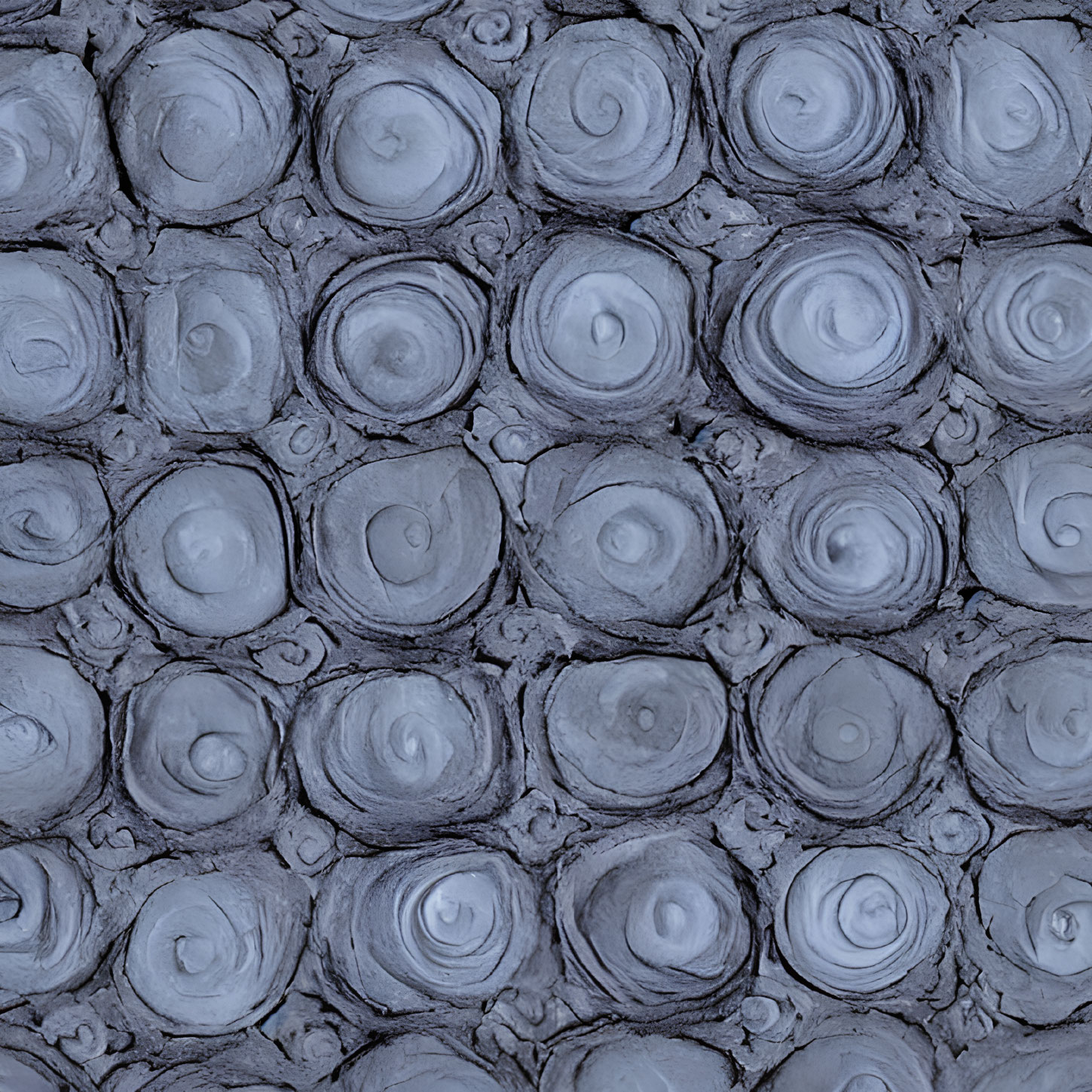 Circular Rose-Like Patterns on Textured Dark Grey Surface