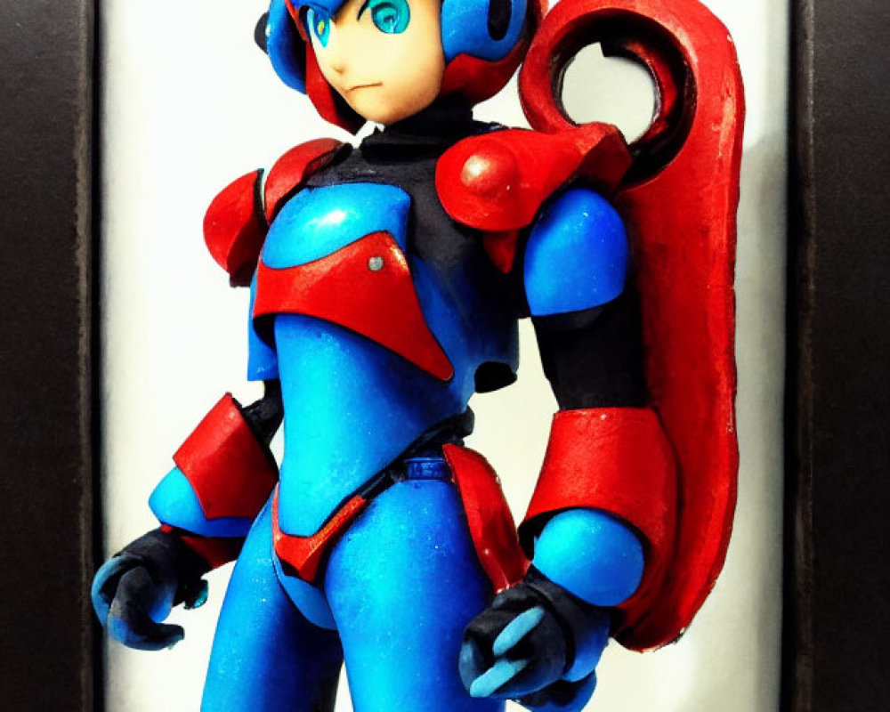 Blue-armored Mega Man figurine in red highlights, showcased in black frame