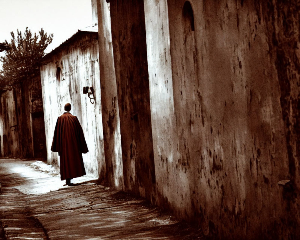 Mysterious figure in cloak strolls down narrow alley at night