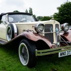 Vintage Art-Deco Classic Car Displayed on Grassy Field