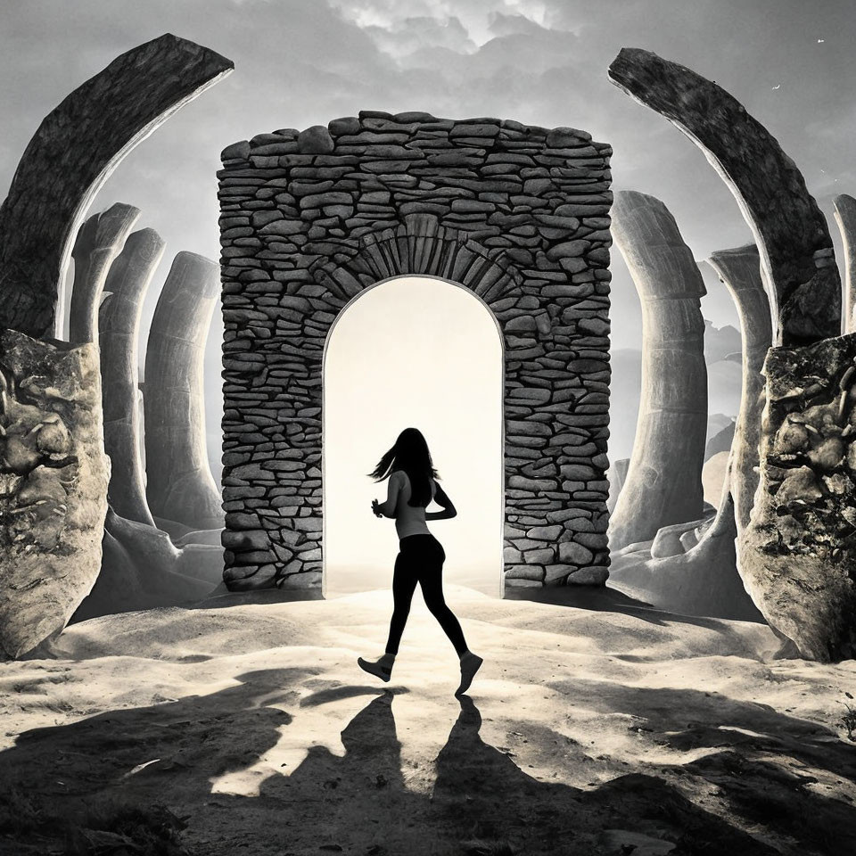 Woman Running Through Stone Archway in Desert Landscape