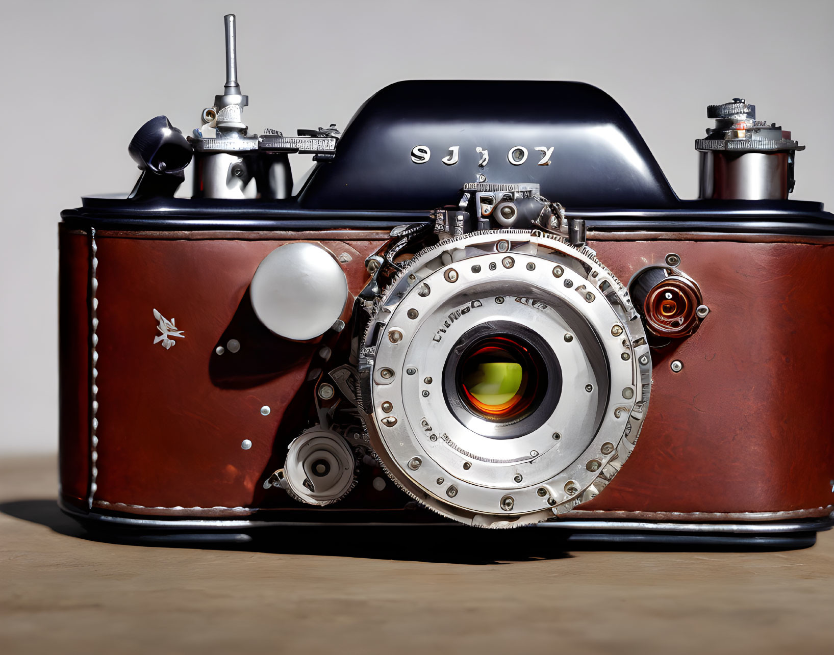 Vintage Camera with Leather Casing and Bright Lens on Neutral Background