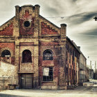 Steampunk-inspired building with curved architecture, pipes, gears on cobblestone street.