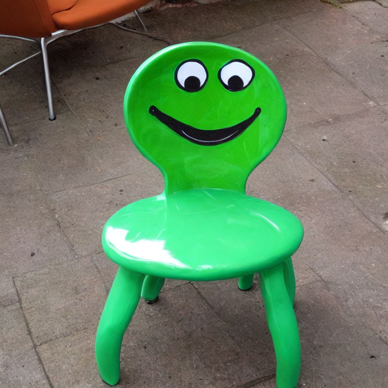 Bright Green Chair with Smiling Cartoon Face on Backrest