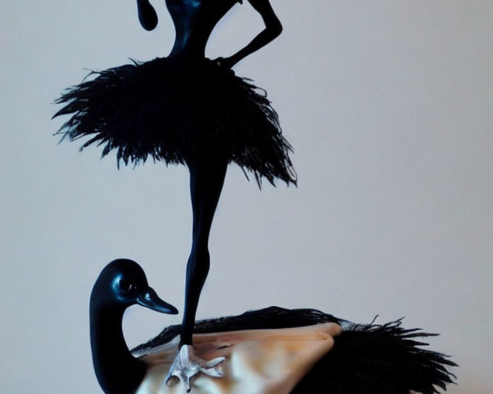 Slender character figurine in black tutu on swan - Detailed description