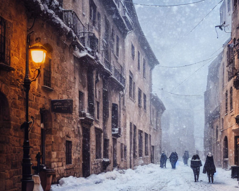 Snow-covered street at twilight with pedestrians and vintage buildings.